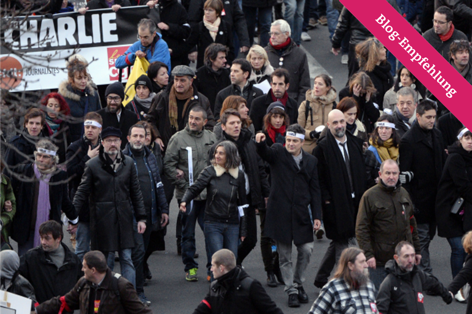 Kolumnist und Notarzt Patrick Pelloux mit anderen Mitgliedern von Charlie Hebdo am Sonntag auf dem "Marche Republicaine" in Paris